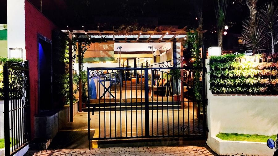 Entrance gate of Kyriad Prestige Calangute, Goa with vehicles parked outside
