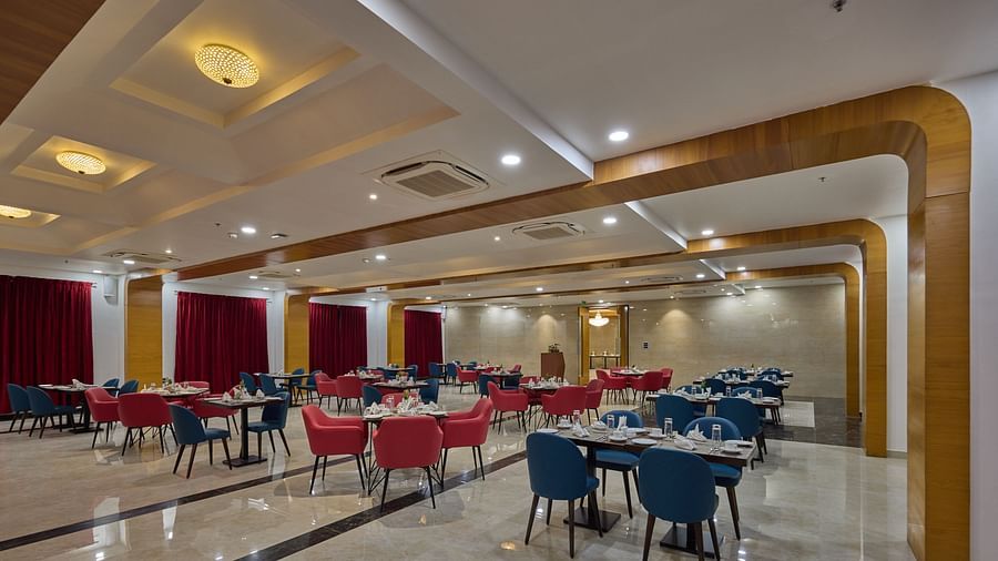 the indoor seating space at the restaurant - Golden Tulip, Tirupati  1