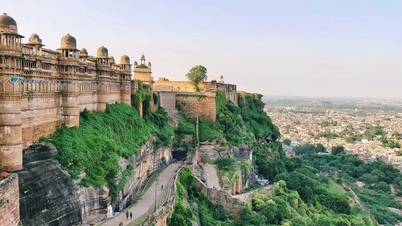 Gwalior Fort perched on a hilltop overlooking lush greenery and the expansive landscape beyond