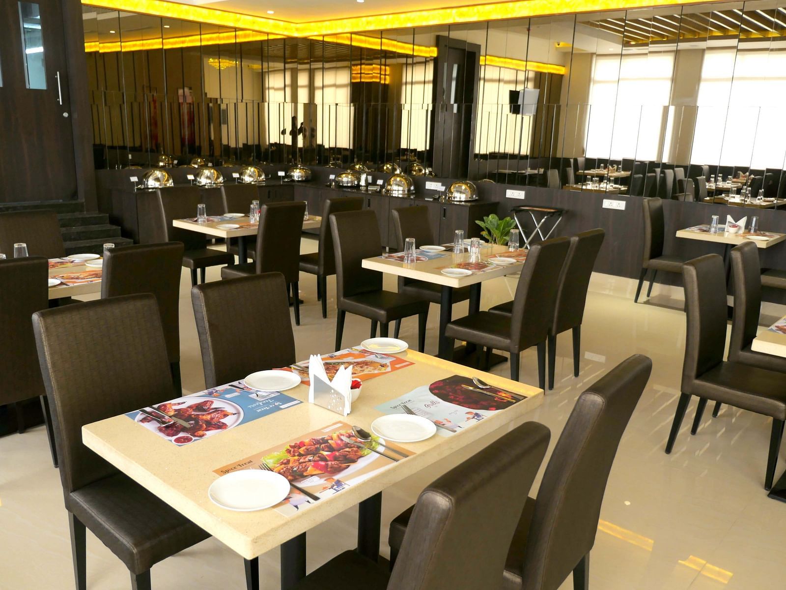 dining of a restaurant with warm lights of ASR Parklane, Hosur