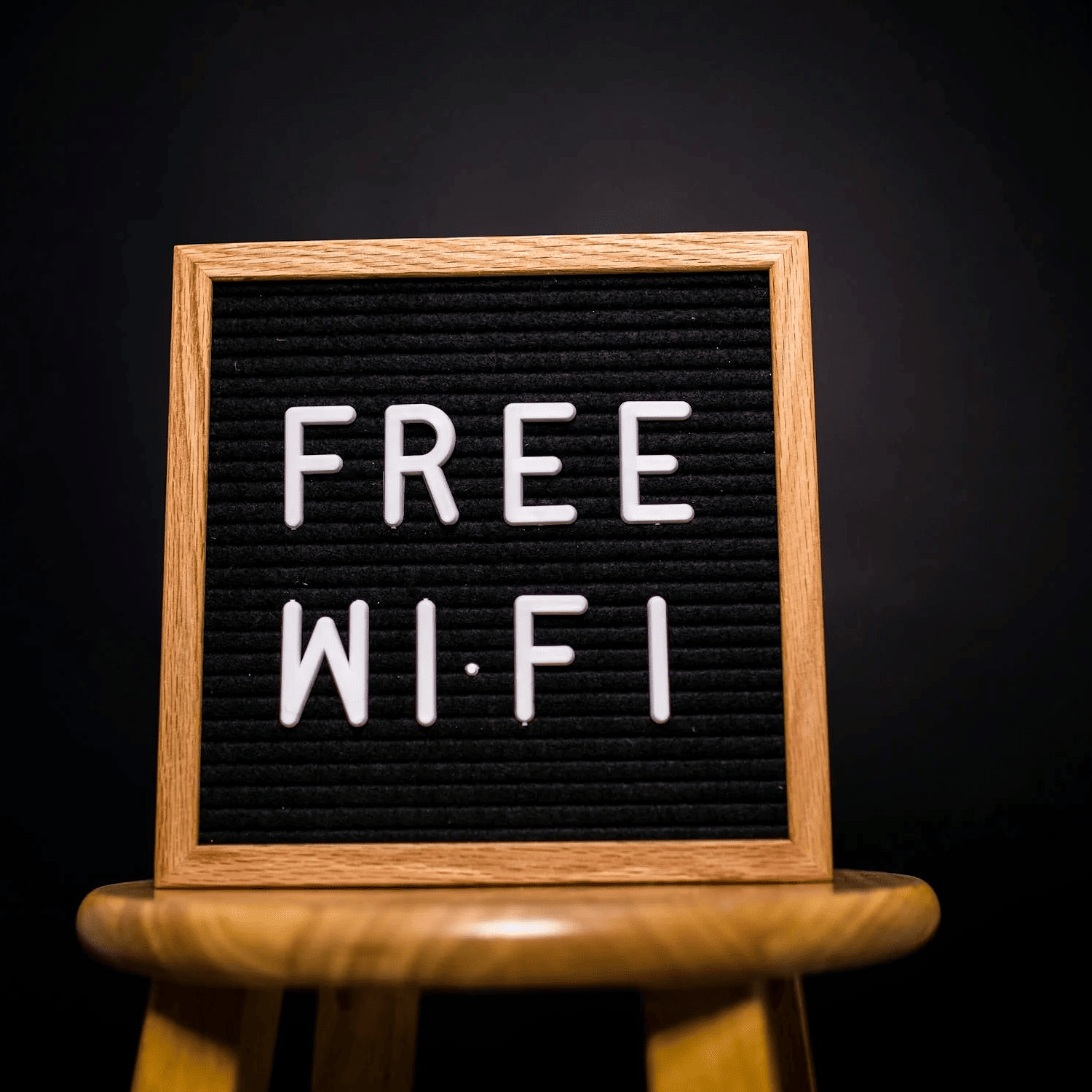 Image of a board with free wifi written on it.