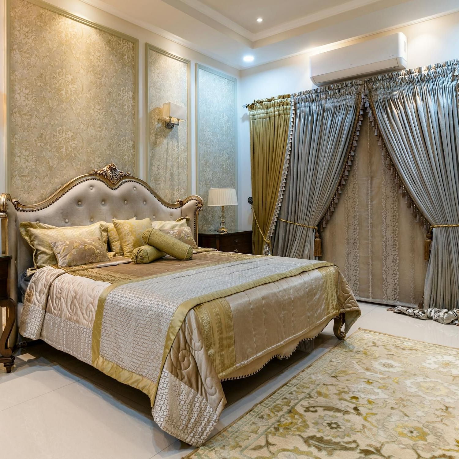 Image of a room with a bed and a large window on the side.