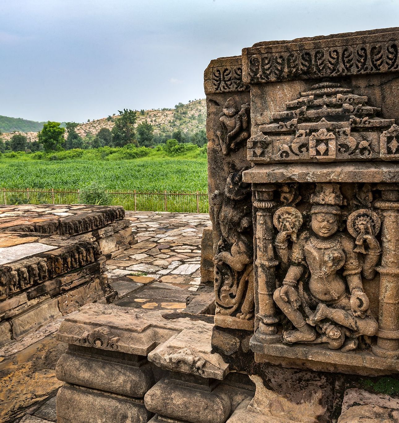 An image of beautiful carvings of gods on the walls of Neelkanth Temple