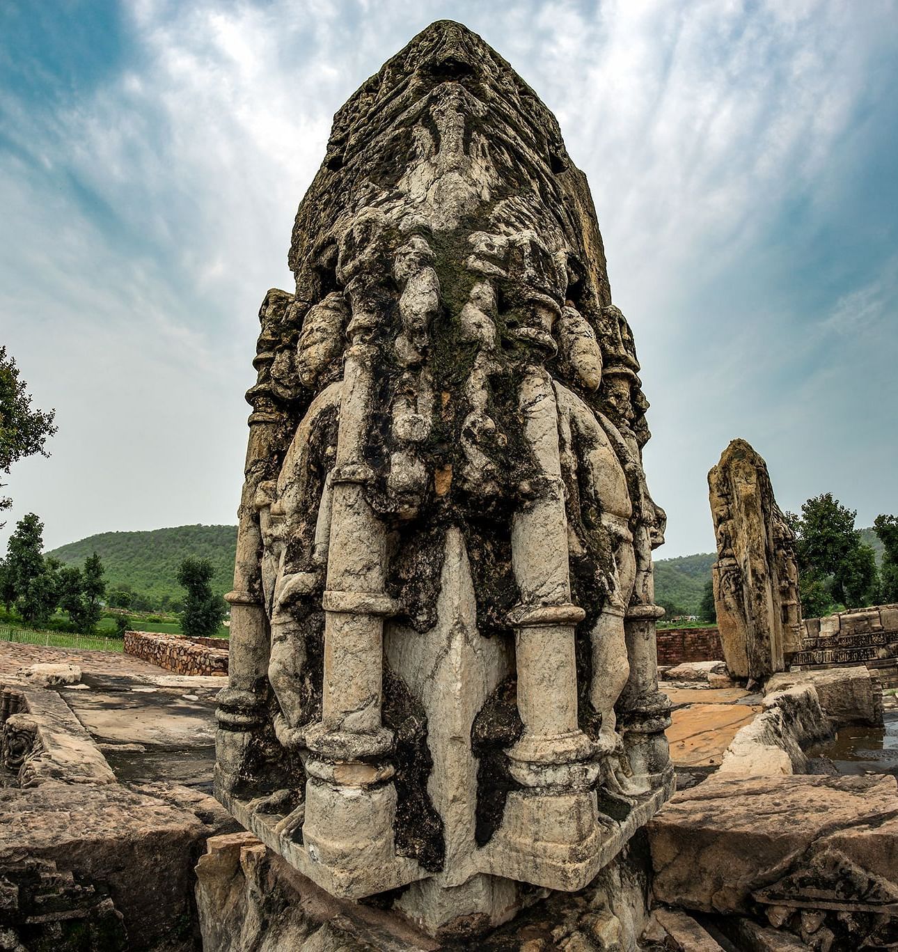 A large statue with intricate carvings at Neelkanth temple