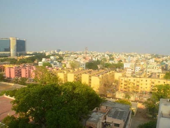 Aerial view of the city with multiple buildings.