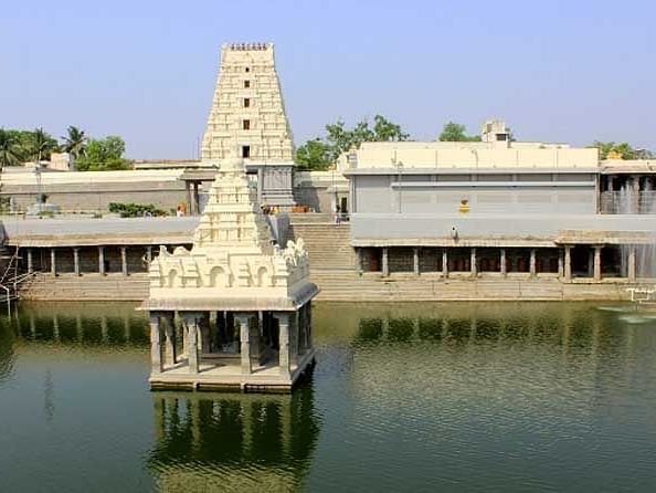 An image of a temple structure in between a lake