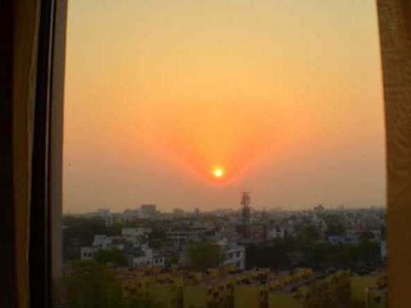 Sunrise with hues of yellow and orange illuminating the sky.