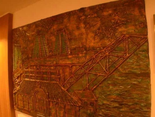An image of an artwork mounted on a wall beside a door