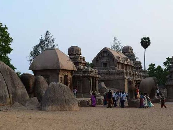 An image of Mahabalipuram showcasing various ancient stone sculptures.