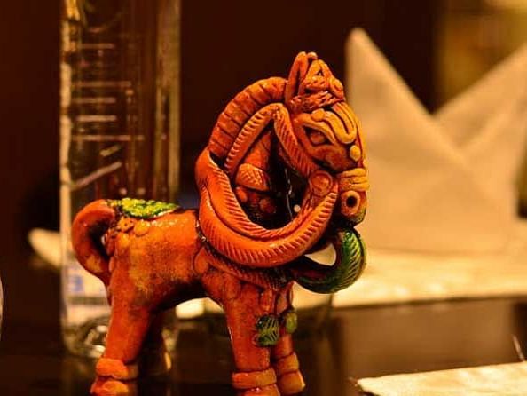 A small statue of a tiny horse.
