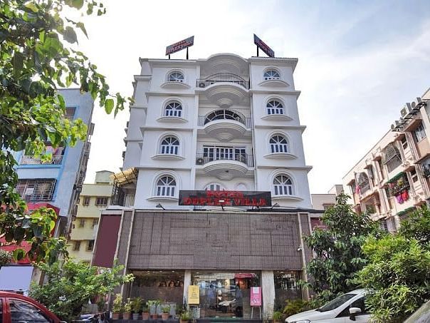 Facade view of Ecotel Kolkata with other building next to it