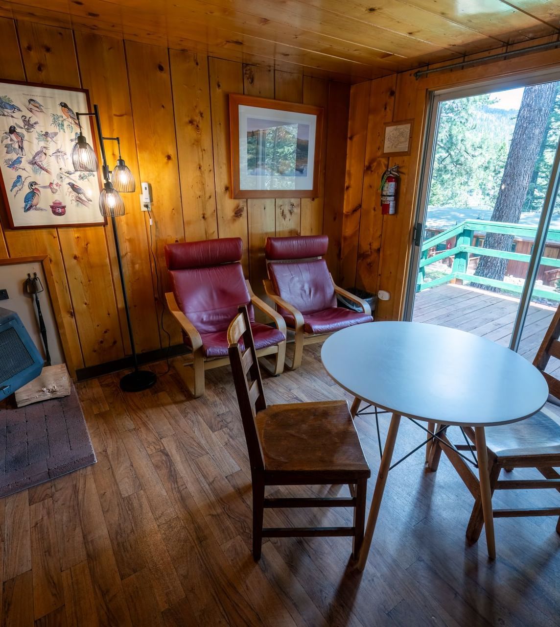 Small dining area with fireplace and outdoor access at Kit Carson Lodge.