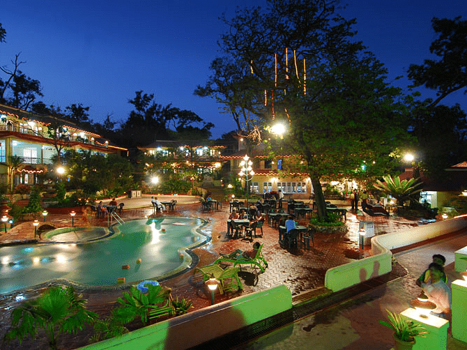 Adamo Matheran Resort - view of the pool along with the hotel in Matheran during evening