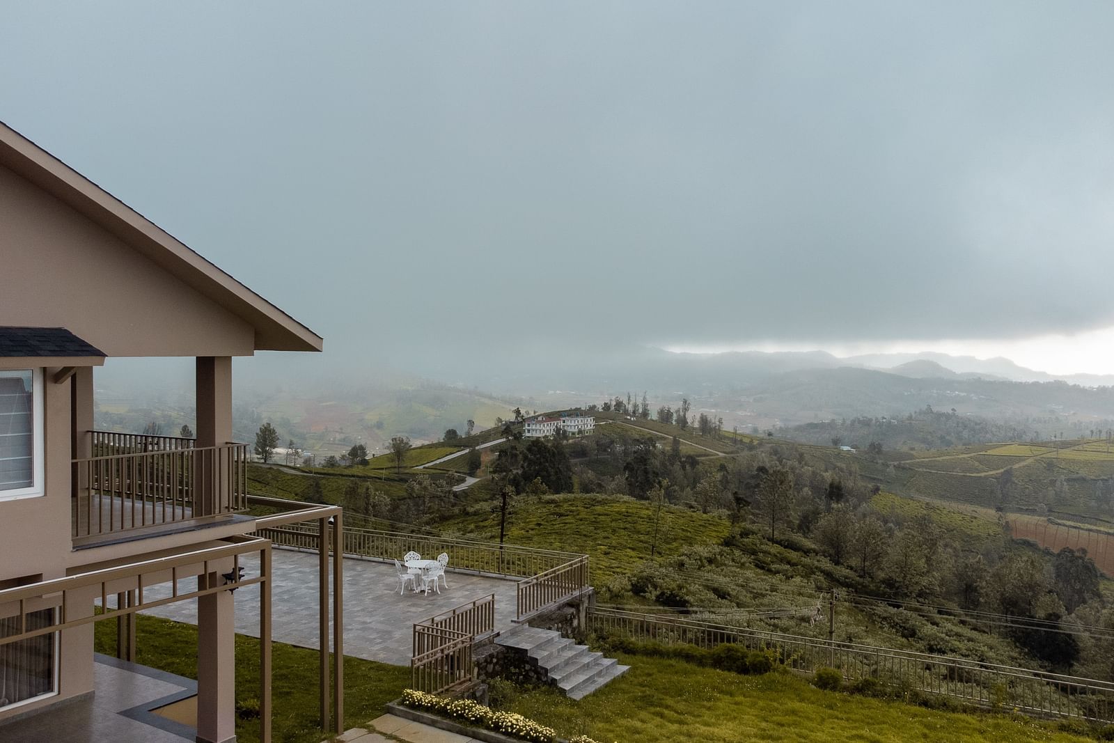 An image of an accommodation on a hill seen during a cloudy day
