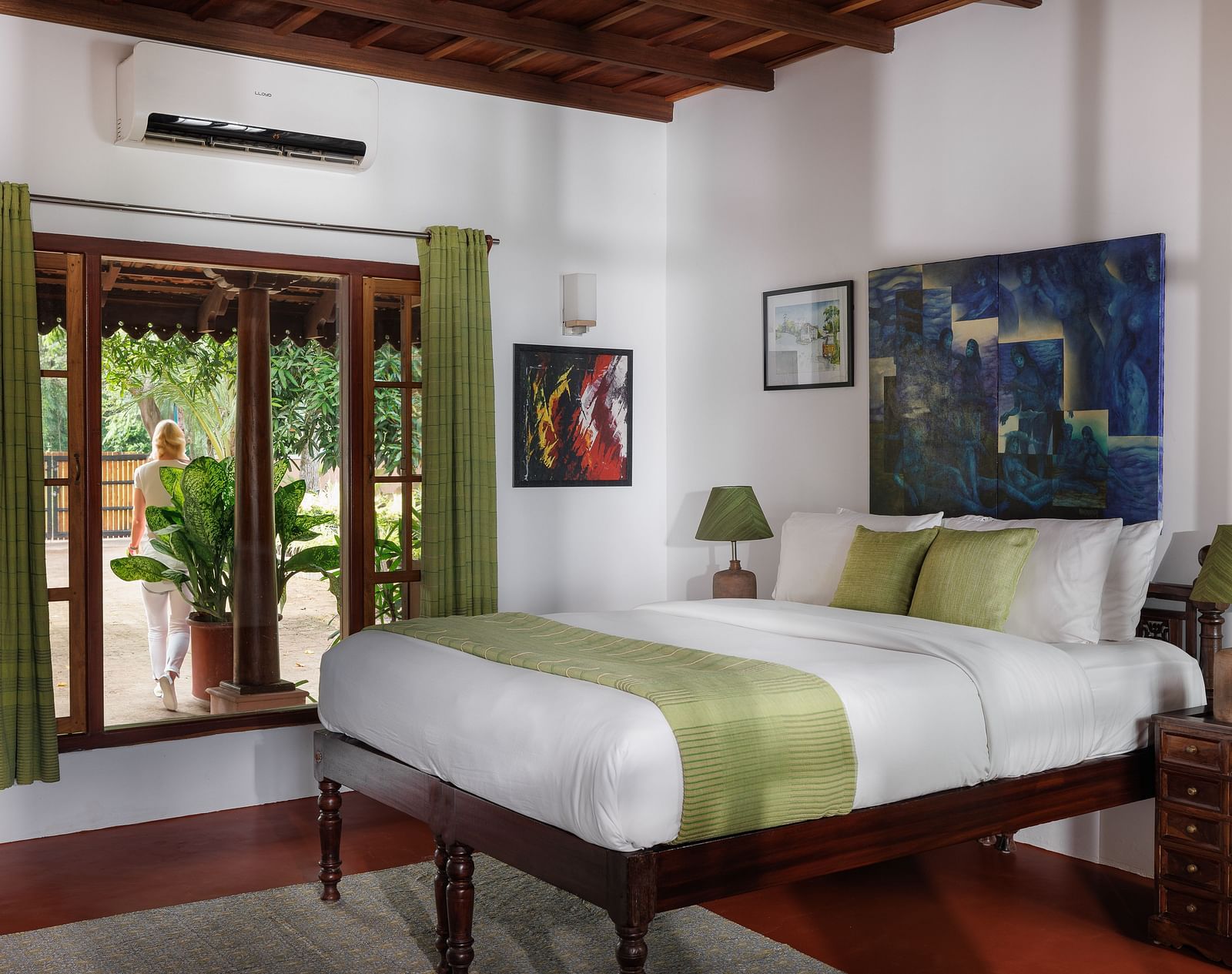 A room with a bed, wooden decorative items, and a glass window overlooking the view - BluSalzz Villas - Muhamma Resort, Alleppey