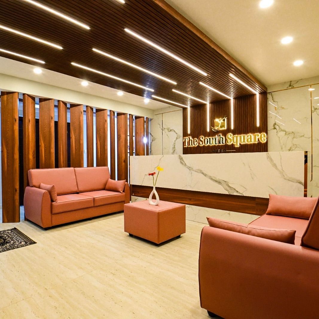 lobby area with comfortable seating of  South Square Hotel, Bengaluru