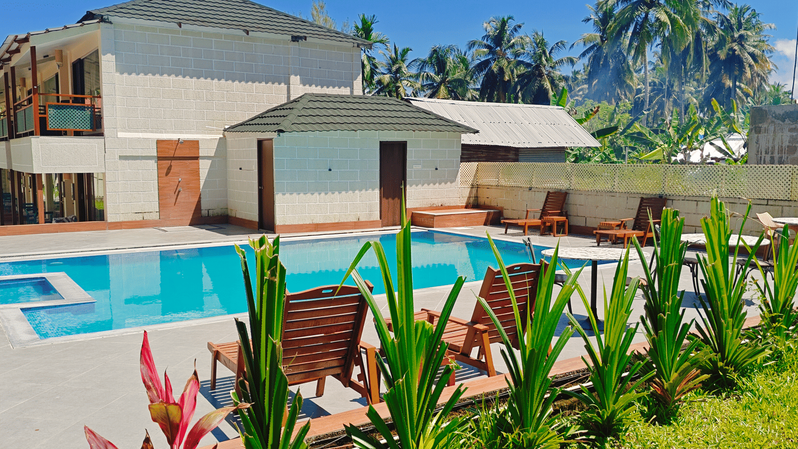 A view of a pool with greenery at Arina Island Resort