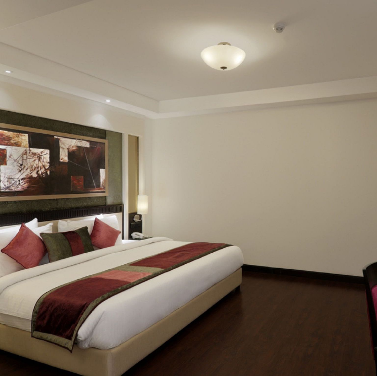 view of large size bed in Suite room of Inde Hotel Vista Woods, Gurgaon 
