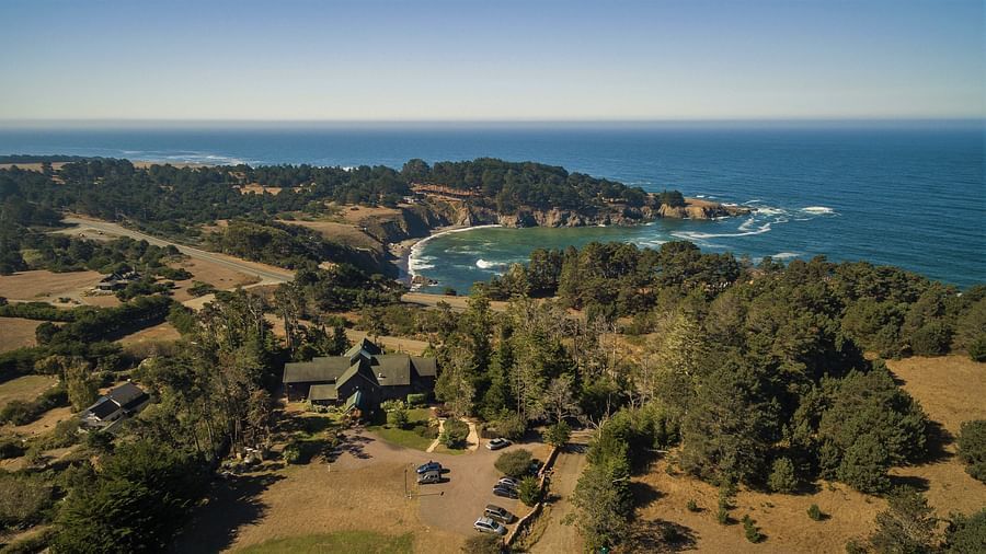 A breathtaking aerial view of Mendocino’s rugged coastline and blue waters - Brewery Gulch Inn & Spa