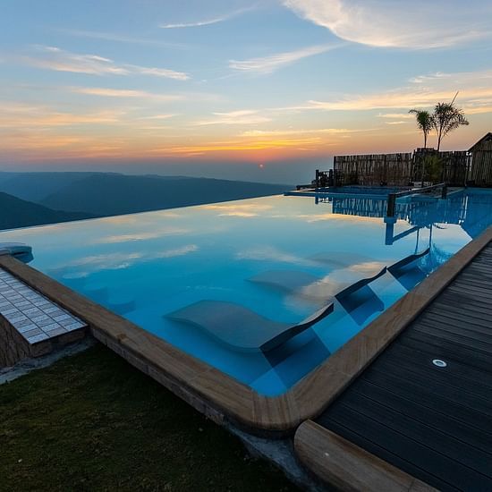 view of our pool at night