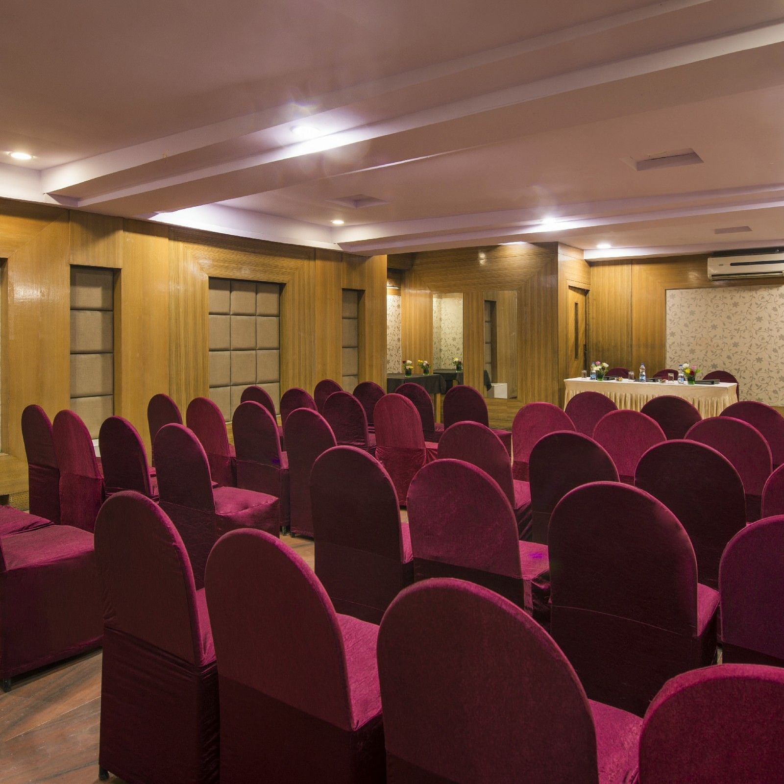 Conference room at Lords Eco Inn Dahej with theatre-style seating and modern presentation setup.