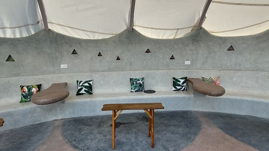 Inviting lounge area with comfortable seating and a unique architectural design.-Matsya Island Retreat by Island Quest.