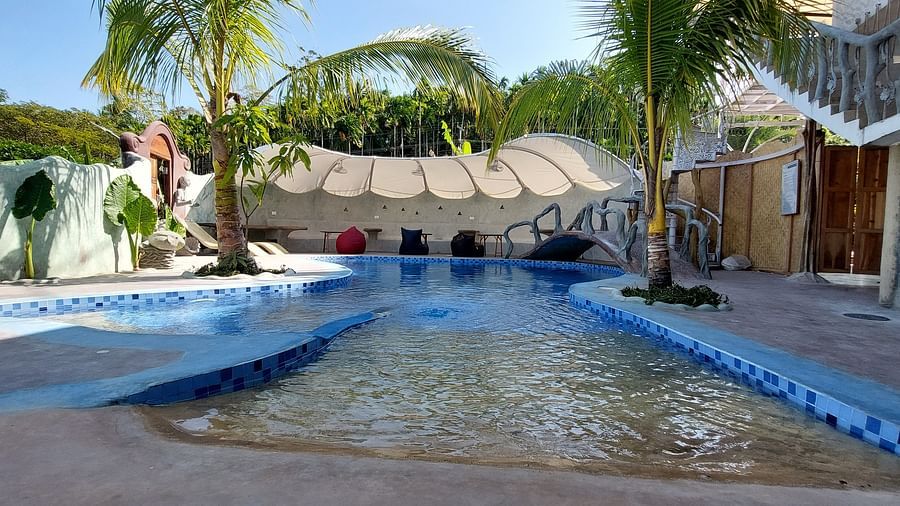 Tranquil retreat with a sparkling pool and lush tropical surroundings -Matsya Island Retreat by Island Quest. 