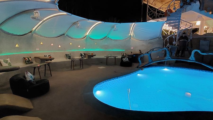 Lively poolside bar with colorful accents and unique lighting - Matsya Island Retreat by Island Quest.