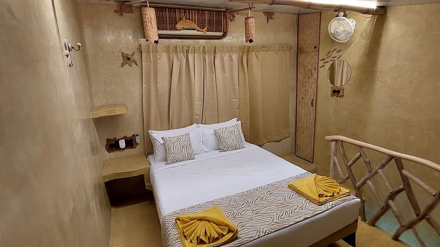 A front of a bed in a room | Matsya Island Retreat