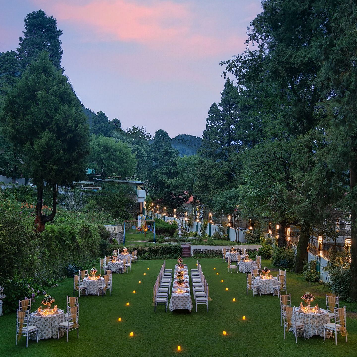 A peaceful garden with colorful flowers and manicured lawns.