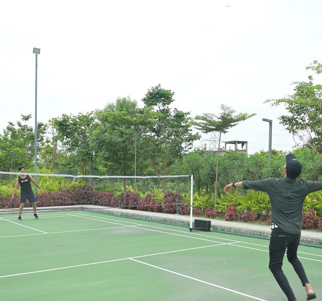 People playing badminton at Singalila Club