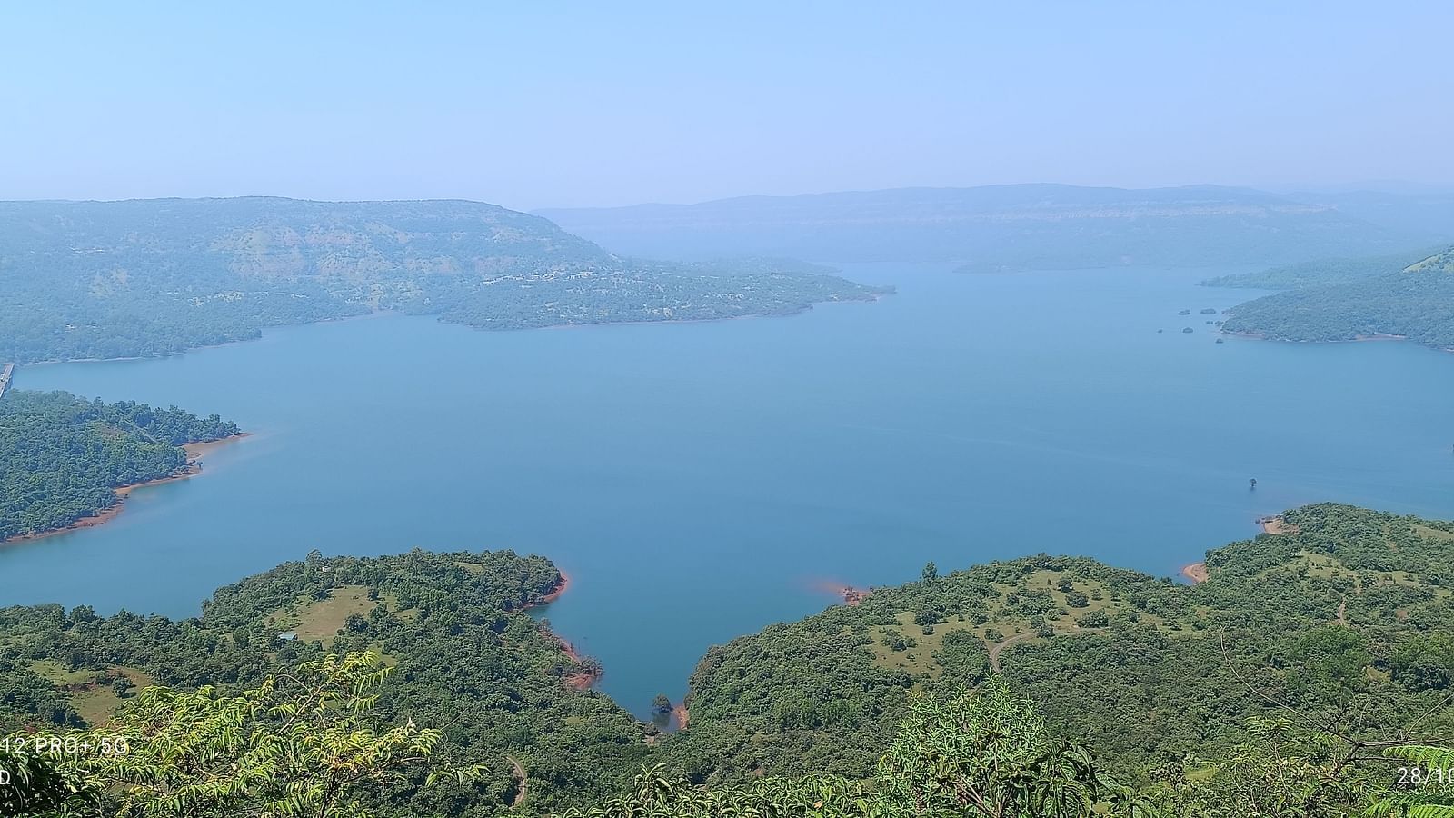 A panoramic view of a river winding through lush landscapes