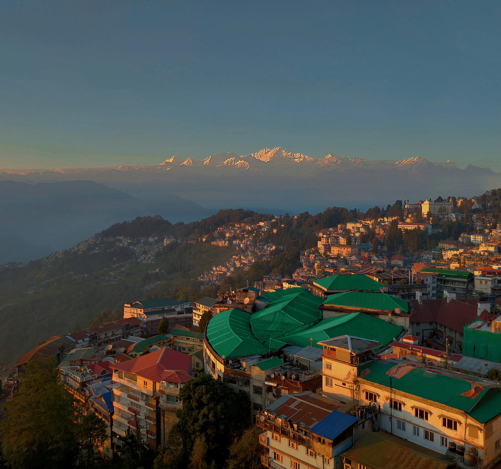 A stunning aerial view of Summit Montana Suites & Spa, Mall Road, with a picturesque sunset sky in the background