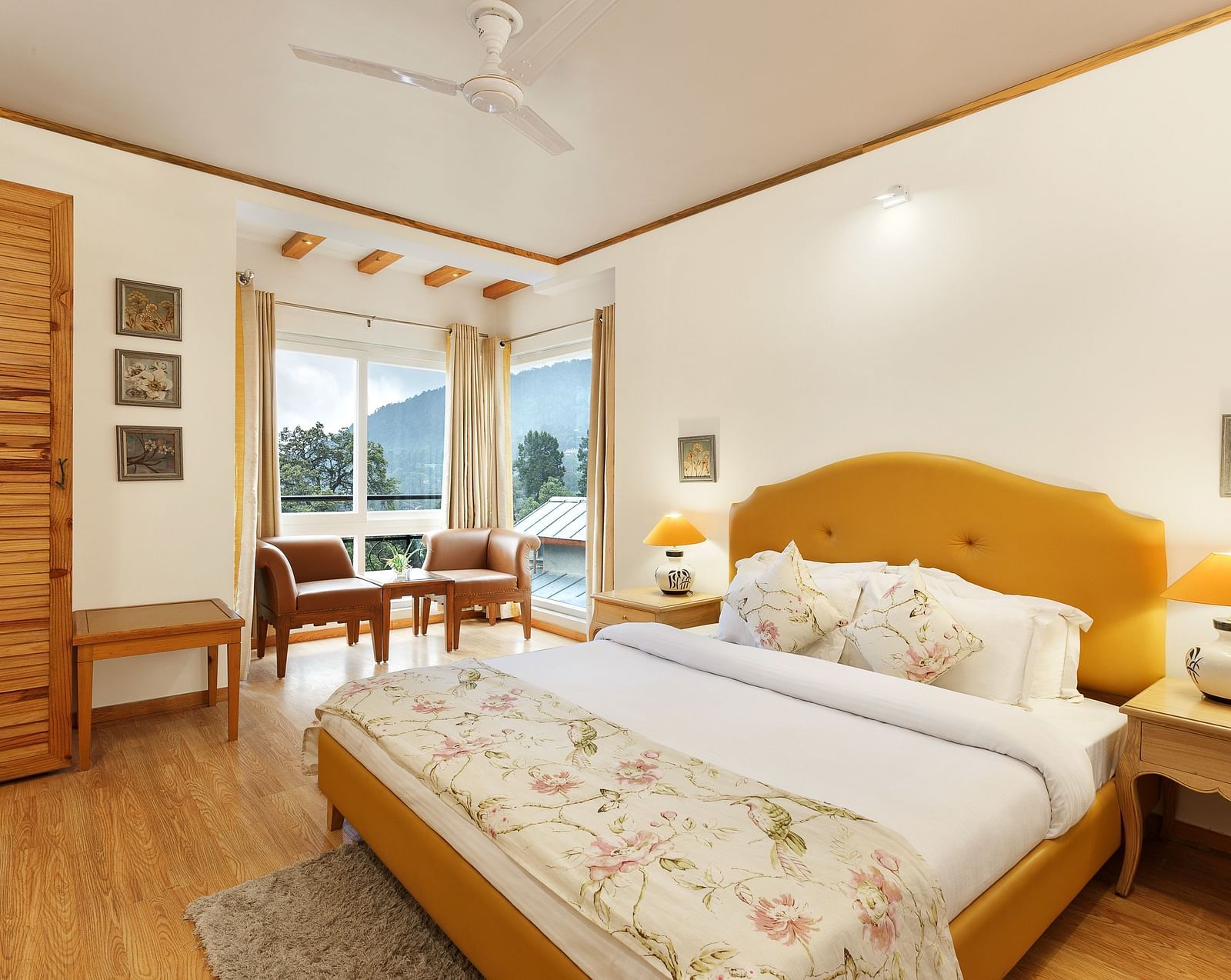 A cosy room with plushy bed, table lamp with makes the ambience homely - Pinewood Nainital 