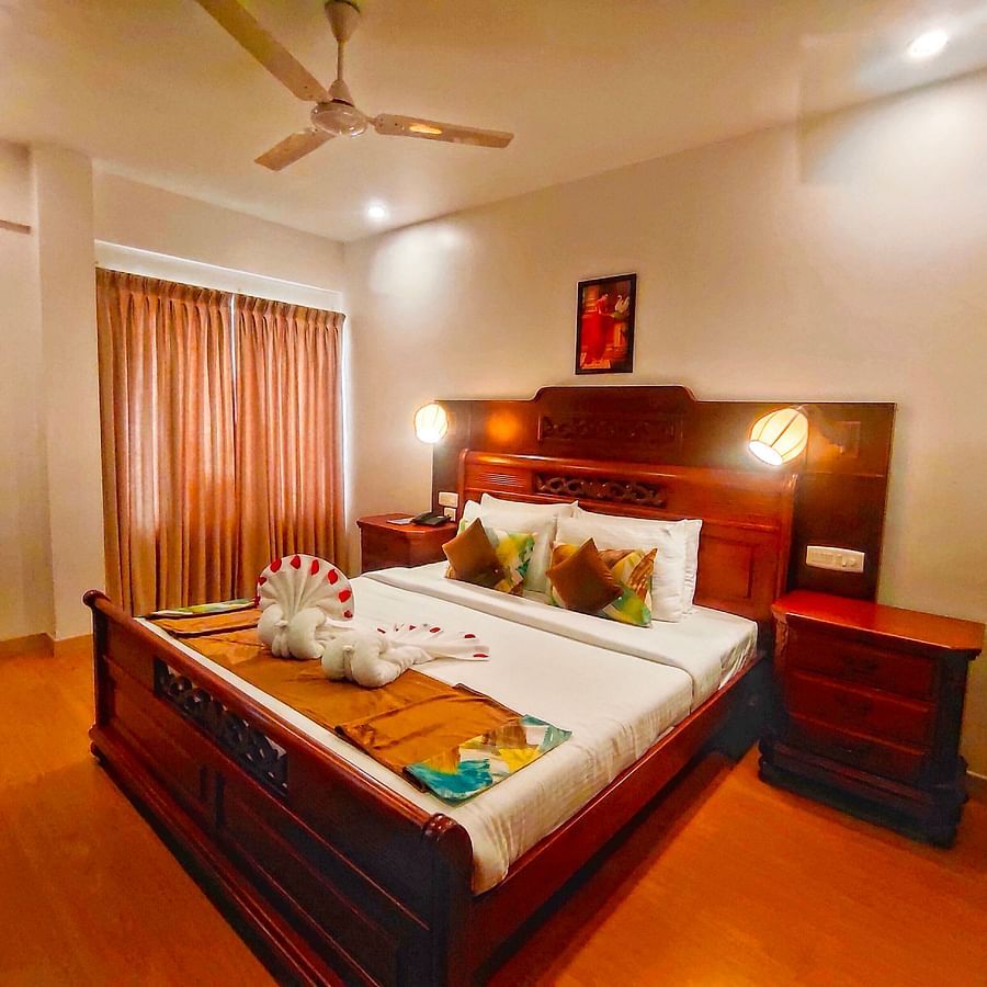 Premium Suite Bedroom with a double bed and side tables