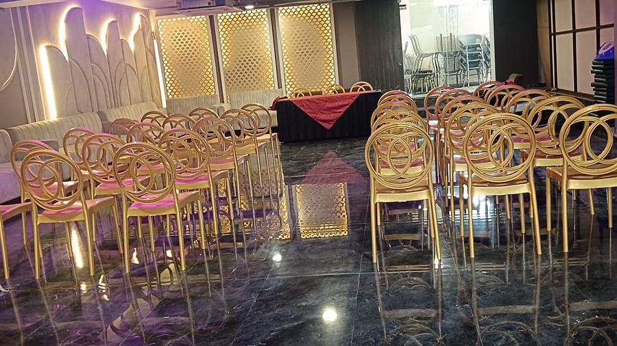 An image of Utsav Banquet hall with several chairs and table set- Bamboo Saa Mulberry Resort, Pushkar