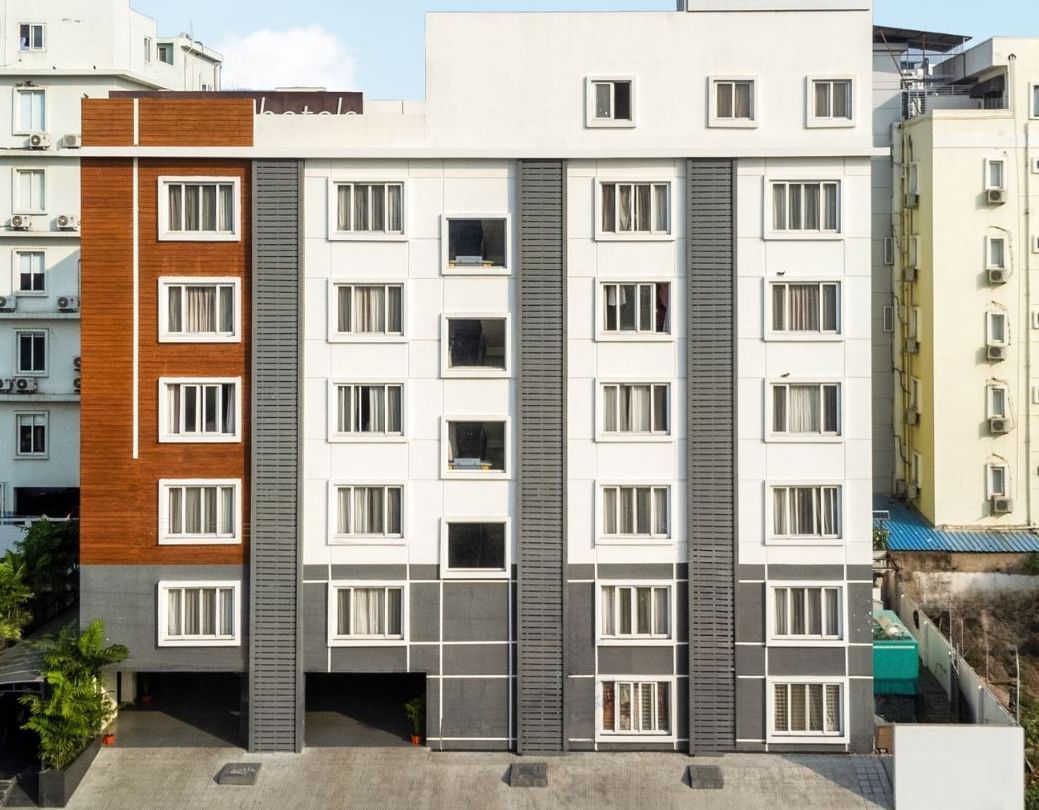 Facade of Destino by Monday Hotels featuring a multi-storey building under a partly cloudy sky.