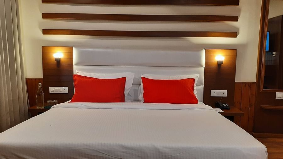 A zoom shot of bed in the deluxe Room at Mastiff Xanadu, Manali