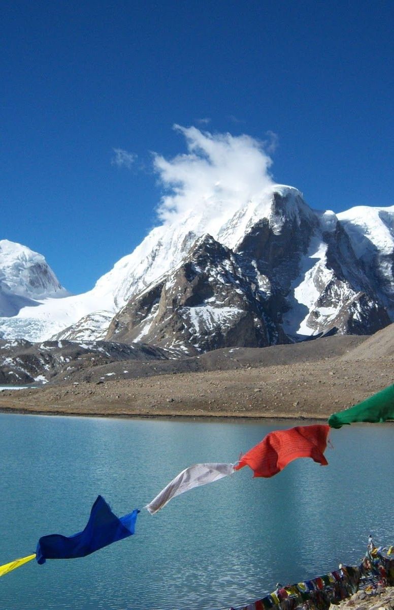 Image of Buddhist Prayer Flag with snow clad montain in the background