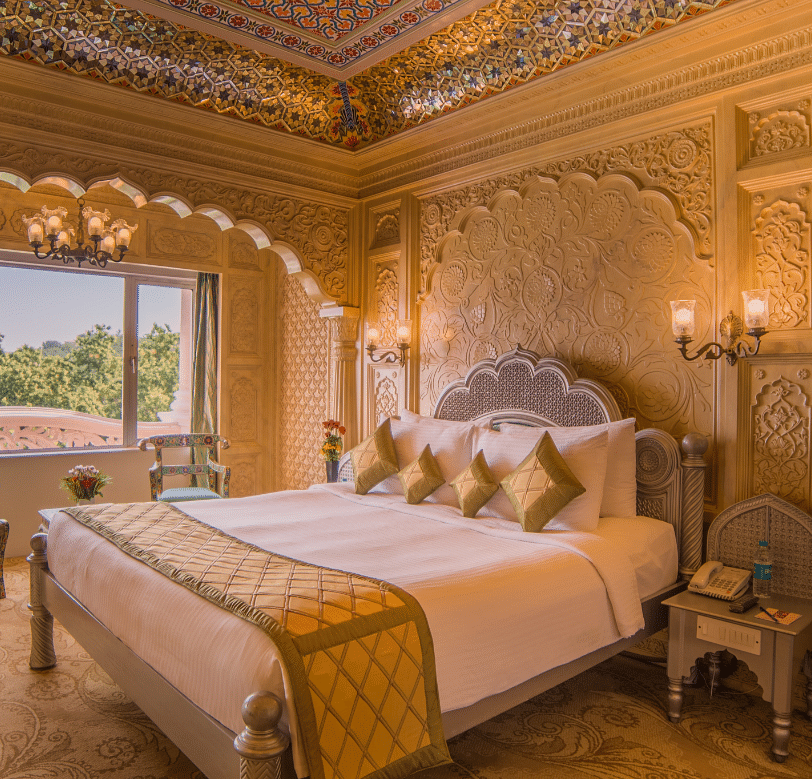 Room at Sitara Luxury Hotel in Hyderabad near Ramoji Film City with a double bed and side tables