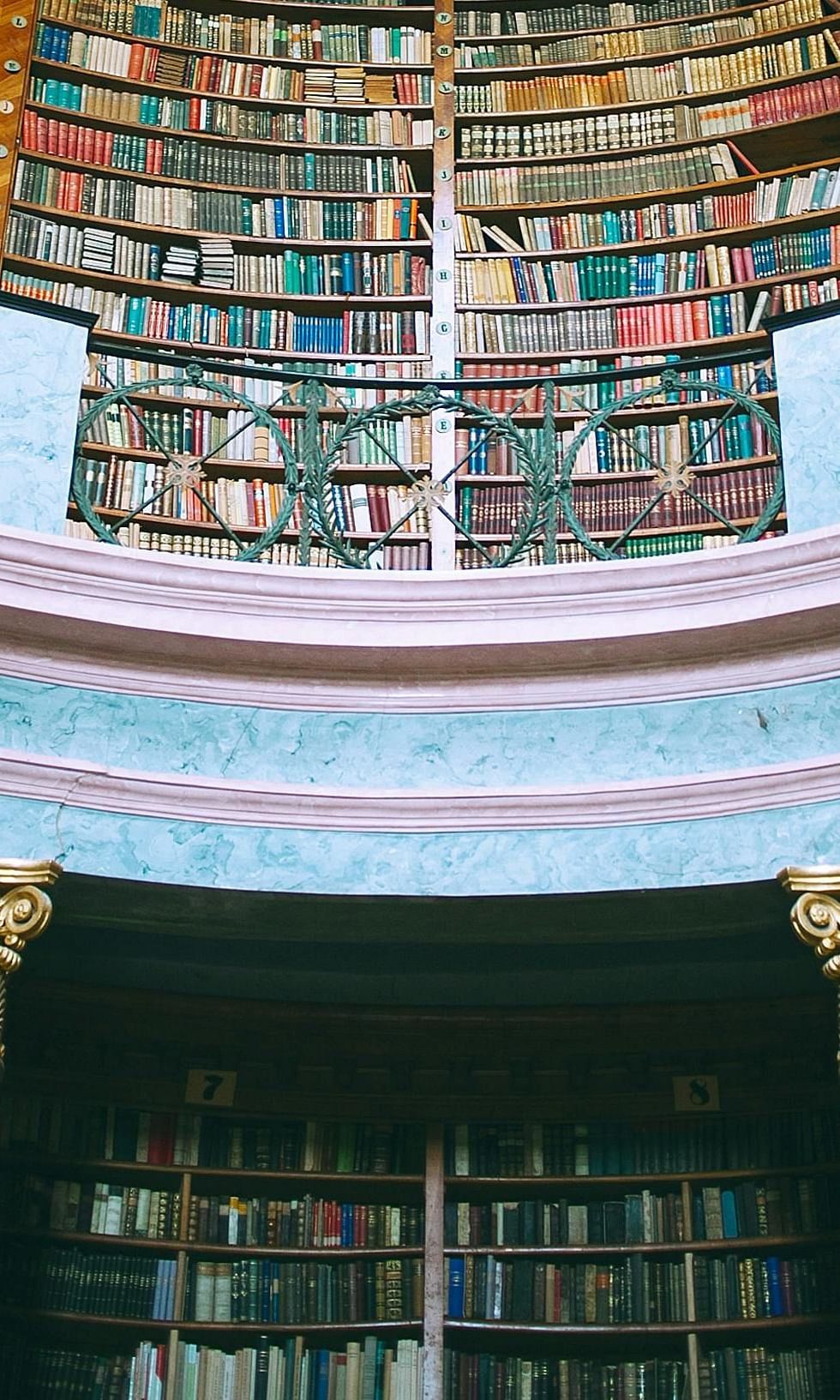 An image of a library with books stacked and the library is shaped like a dome