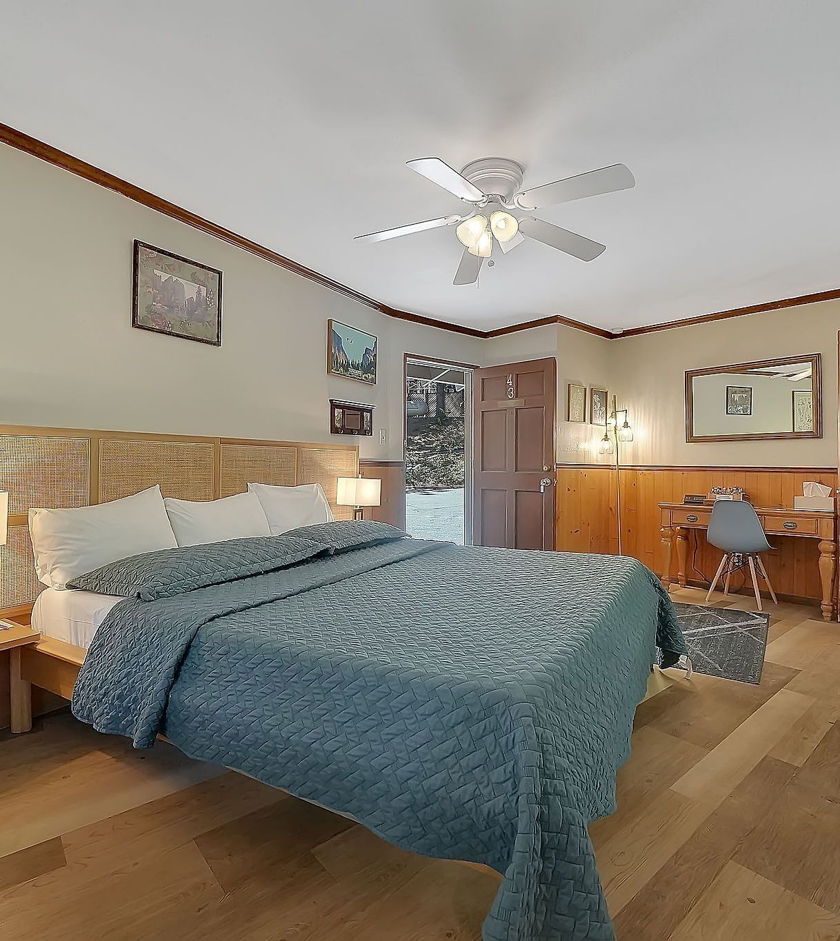A room at Narrow Gauge Inn with a double bed and side tables with table lamps.