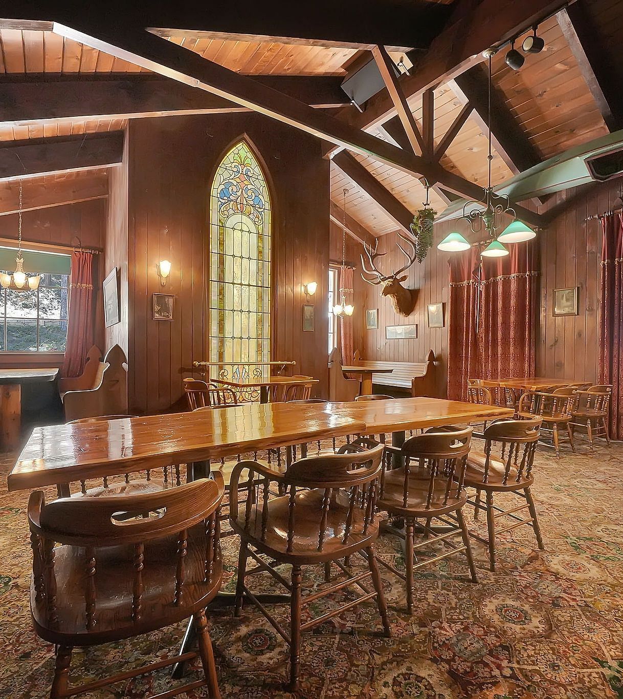 A view of a dining arrangement in a cabin with wooden interiors