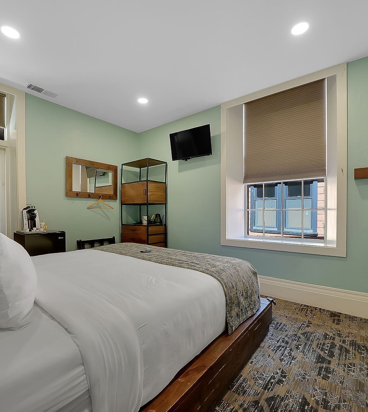 A view of a room at The Groveland Hotel with a double bed.