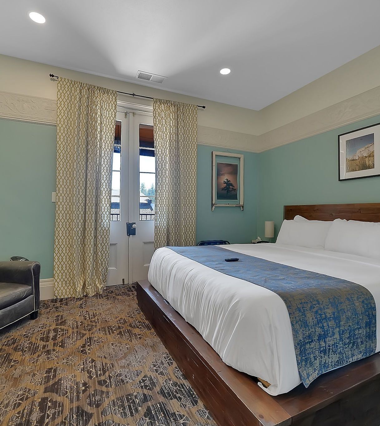 A view of a room at The Groveland Hotel with a double bed.