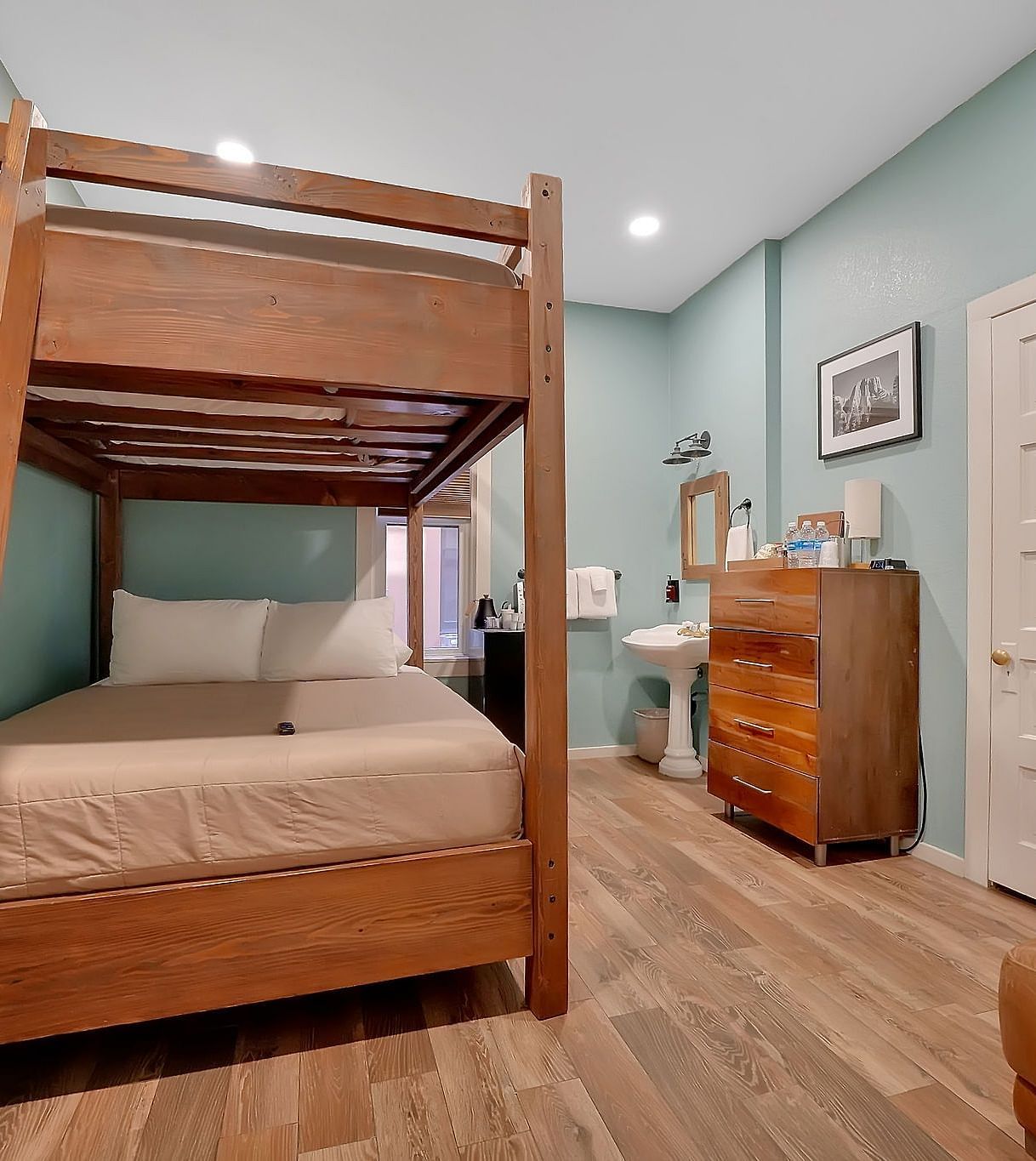 A view of a room at The Groveland Hotel with bunk beds.