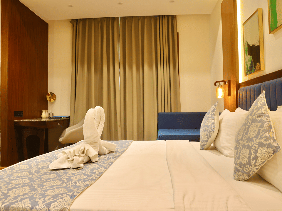 Skyline by Miraya, Classic Room, King bed dressed with swan towel art