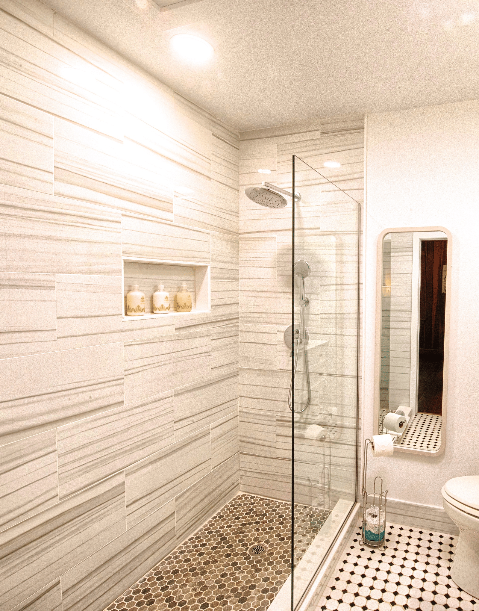 a bathroom with white interiors well equipped with a shower area separated with a glass partition - Historic Tapoco Lodge