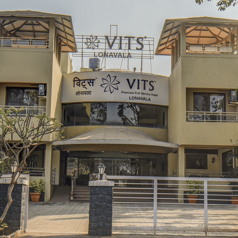 Close-up of hotel exterior signage and entrance gate at VITS Lonavala.