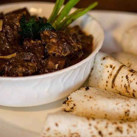 Pandi Curry (Coorg pork curry) with rice rotis.